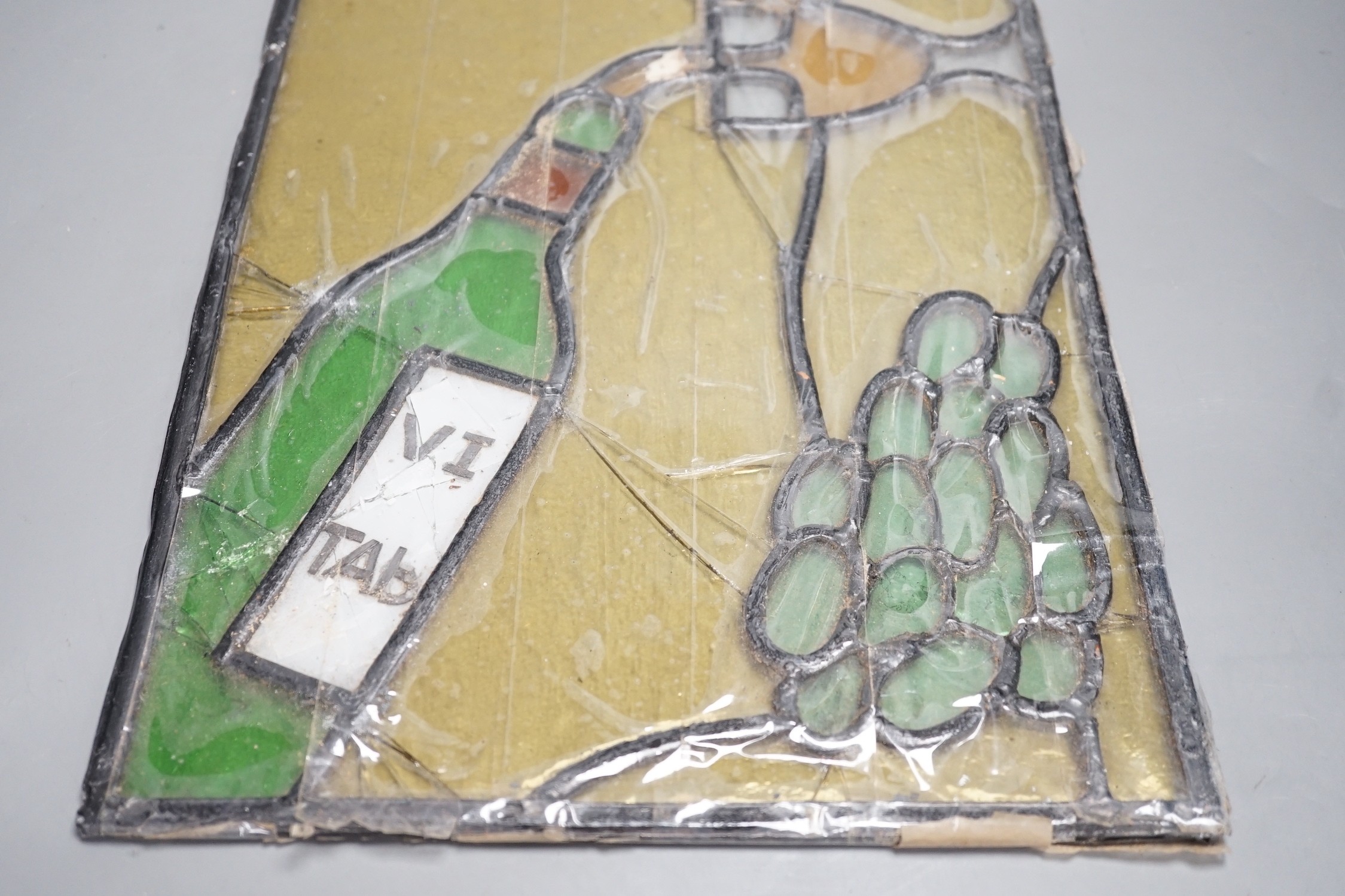 A wine related stained glass panel, 28cms wide x 38cms high